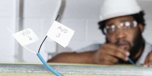 Man using Rite-On Flagger to label wires